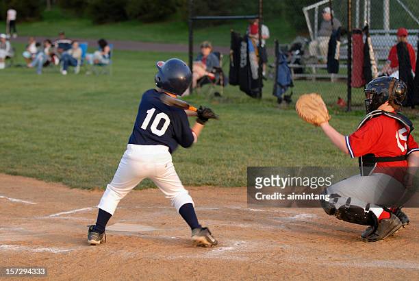 boys at baseball game - defence player stock pictures, royalty-free photos & images