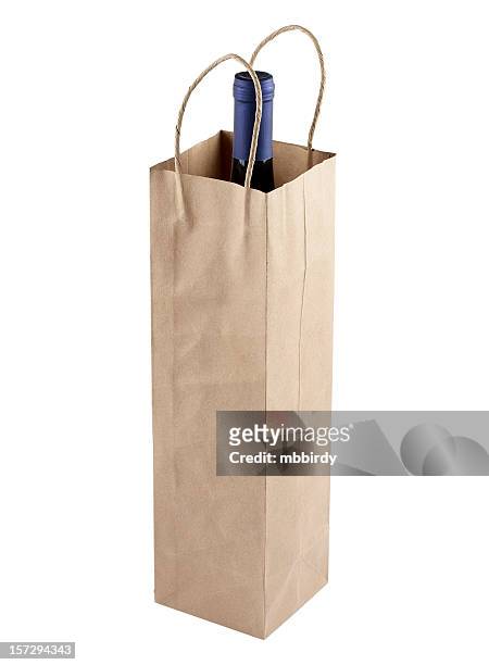 wine bottle in gift bag, isolated on white background - wine gift stock pictures, royalty-free photos & images