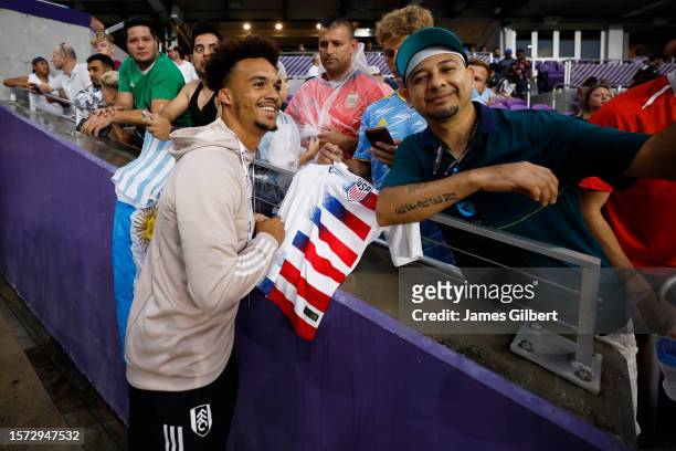 Antonee Robinson of Fulham poses for a photo with fans prior to the Premier League Summer Series match between Aston Villa and Fulham FC at Exploria...