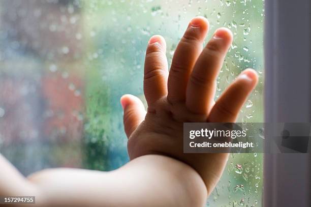 baby's hand - caught in rain stock pictures, royalty-free photos & images