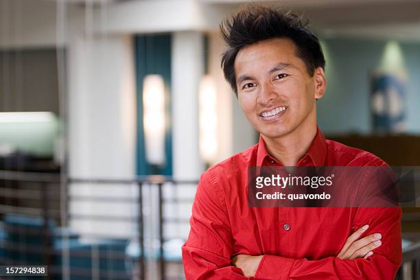 asian businessman portrait with arms crossed in office, copy space - red shirt stock pictures, royalty-free photos & images