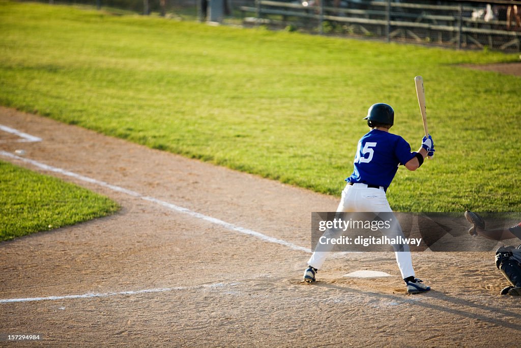 Baseball player about to hit a home run