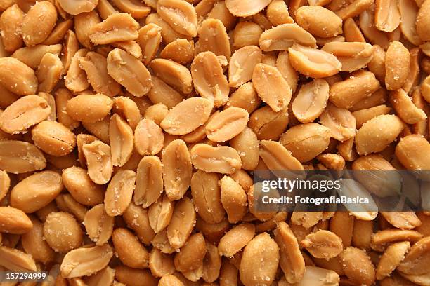 salted peanuts background - salted peanuts stock pictures, royalty-free photos & images