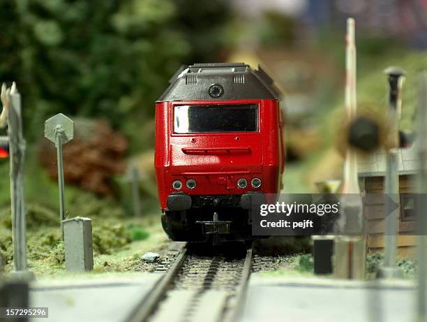 model diesel locomotive scale h0 passing crossing - model train stock pictures, royalty-free photos & images