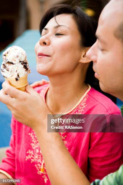 sharing ice cream - fudge ripple ice cream stock pictures, royalty-free photos & images