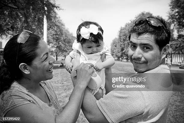 black and white hispanic family outside with baby - mexican mothers day 個照片及圖片檔