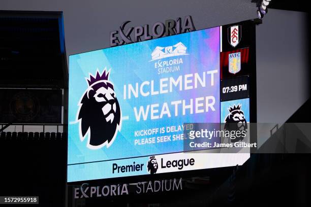 Weather message is displayed on the LED screen as bad weather delays kick off prior to the Premier League Summer Series match between Aston Villa and...
