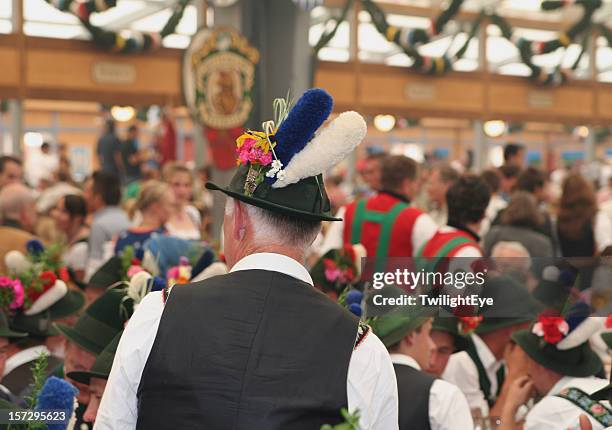 celebration at the beer fest inside a bavarian tent - munich germany stockfoto's en -beelden