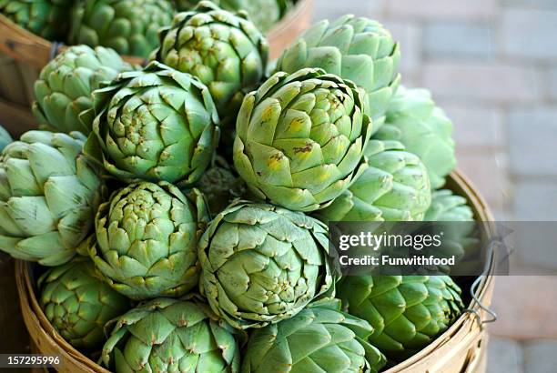 artichokes baskets, fresh spring vegetables food at farmer's market - artichoke stock pictures, royalty-free photos & images