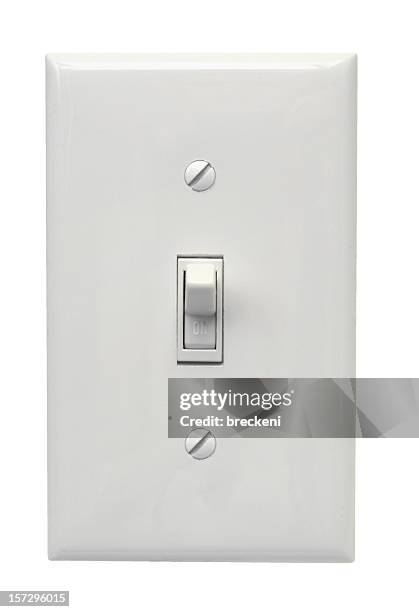 white light switch in the on position - light switch stock pictures, royalty-free photos & images