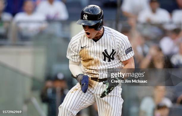 Harrison Bader of the New York Yankees reacts after scoring a run during the third inning against the New York Mets at Yankee Stadium on July 26,...