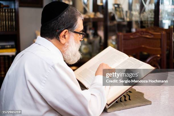 orthodox jewish man studies holy texts in hebrew - mexico city, mexico - haredi judaism stock pictures, royalty-free photos & images