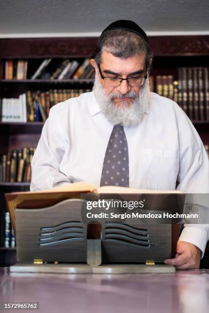 orthodox jewish man studies holy texts in hebrew - mexico city, mexico - haredi judaism stock pictures, royalty-free photos & images