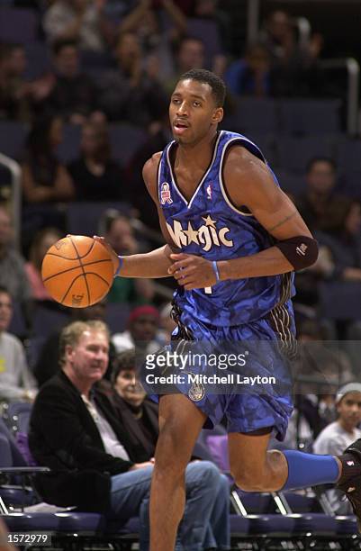 Tracy McGrady of the Orlando Magic dribbles the ball upcourt during a game against the Washington Wizards at the MCI Center in Washington, D.C....