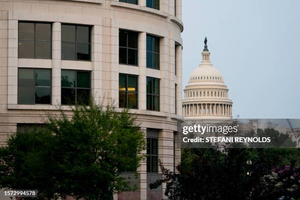 The US Capitol is seen past the E. Barrett Prettyman US Courthouse in Washington, DC, on August 2 ahead of the arraignment of former US President...