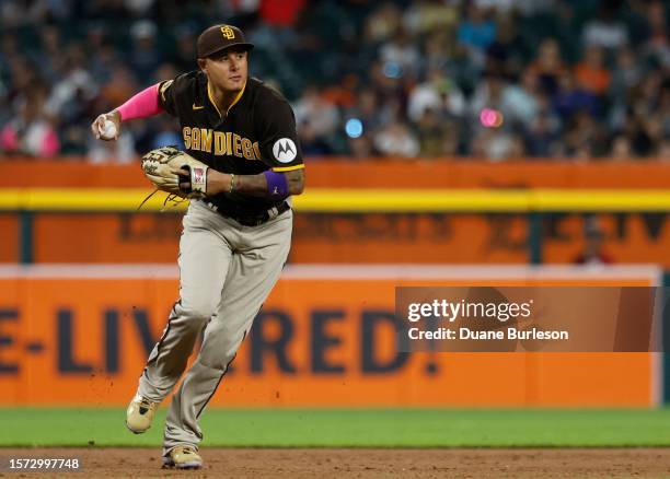 Third baseman Manny Machado of the San Diego Padres throws out Andy Ibanez of the Detroit Tigers at first base during the seventh inning at Comerica...