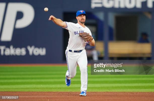 Paul DeJong of the Toronto Blue Jay fields a ball against the Baltimore Orioles during the fourth inning in their MLB game at the Rogers Centre on...