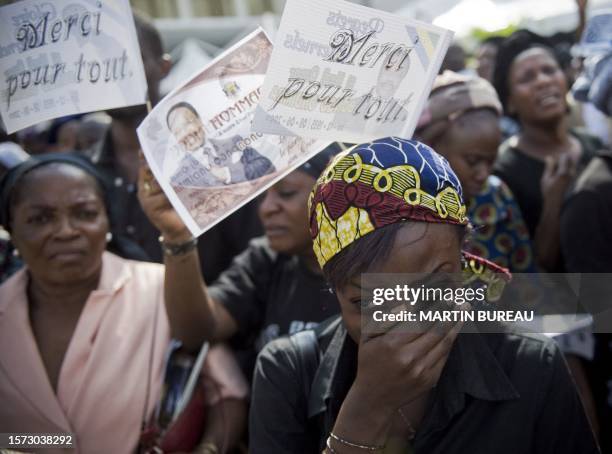 Woman cries during the funeral of late Gabonese President Omar Bongo, on June 16, 2009 in Libreville. Bongo died in Barcelona from cancer on June 8,...