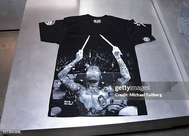 Atmosphere shot of the new Travis Barker X OLOC t-shirt being highlighted at the launching of the One Life One Chance web store on December 1, 2012...