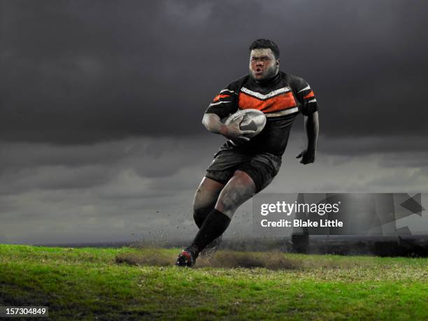 rugby player running with ball. - rugby spieler stock-fotos und bilder