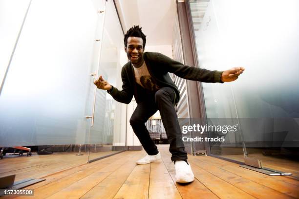 make dancing toward a camera on the ground - low angle view man stock pictures, royalty-free photos & images