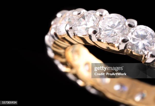 close up view of gold ring with diamonds - diamond ring stock pictures, royalty-free photos & images