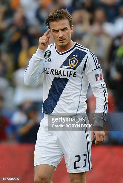 David Beckham Los Angeles Galaxy gestures to a teammate during the second half of of the Galaxy's 3-1 victory against the Houston Dynamo to win the...