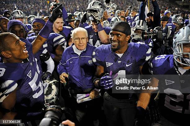 Head coach Bill Snyder of the Kansas State Wildcats and Linebacker Arthur Brown walk off the field after defeating the Texas Longhorns for the Big 12...