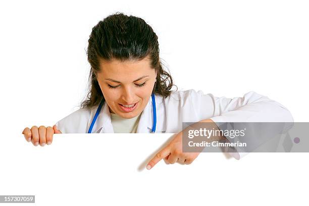 female doctor holding a blank sign (on white) - blank sign stock pictures, royalty-free photos & images