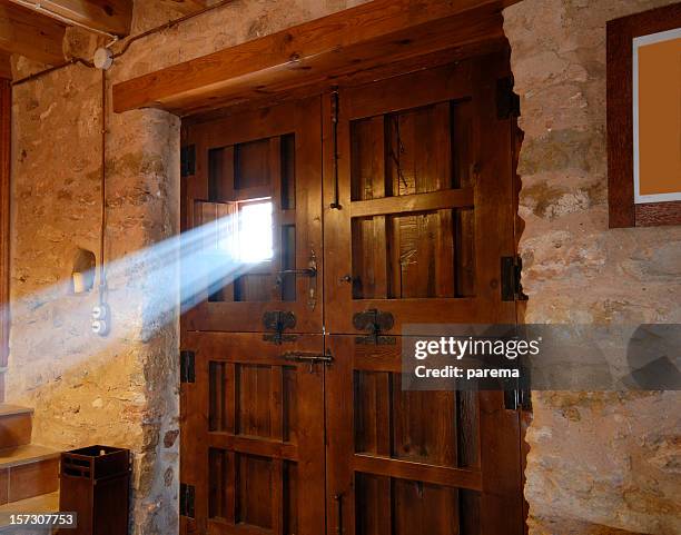 sunbeam passing through a door window - door light rays stock pictures, royalty-free photos & images