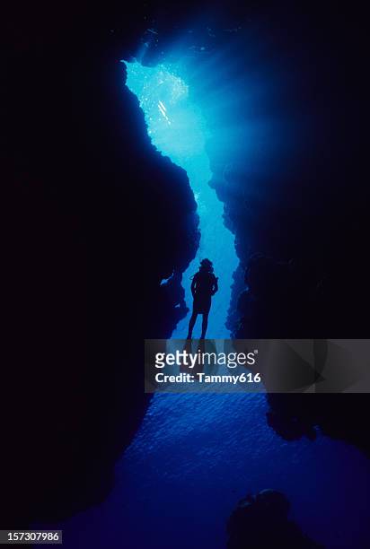 woman in cave - royal blue stock pictures, royalty-free photos & images
