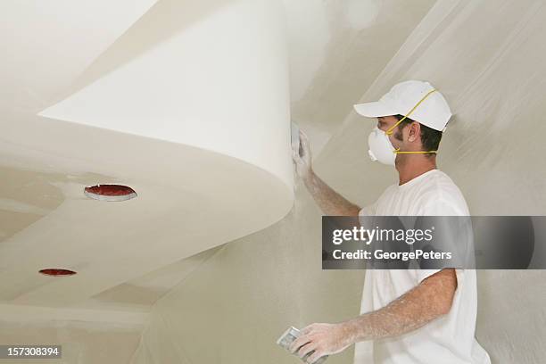 sanding fresh sheetrock - plasterboard stock pictures, royalty-free photos & images