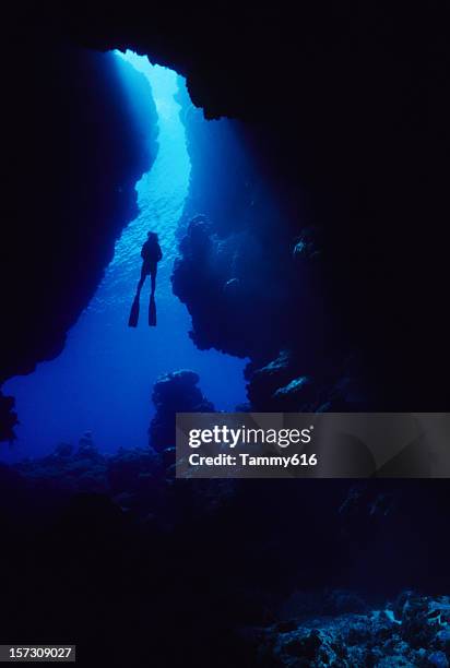 blue underwater cavern - light at the end of the tunnel stock pictures, royalty-free photos & images