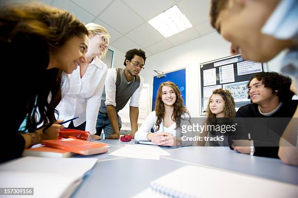 further education: diverse teenagers working on a class project - panel discussion stock pictures, royalty-free photos & images