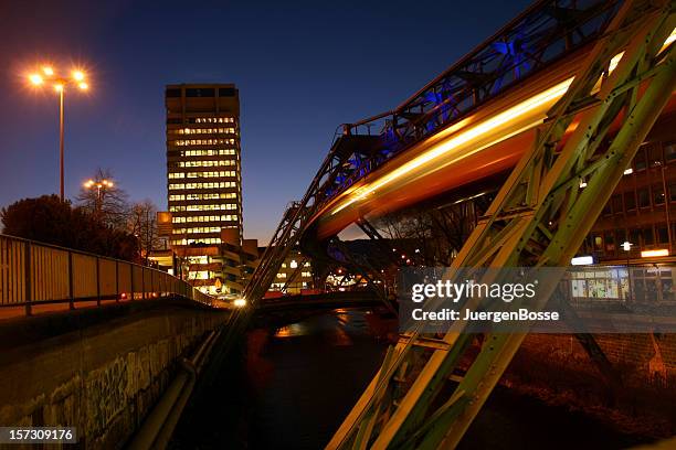 sky train at night in wuppertal - wuppertal stock pictures, royalty-free photos & images