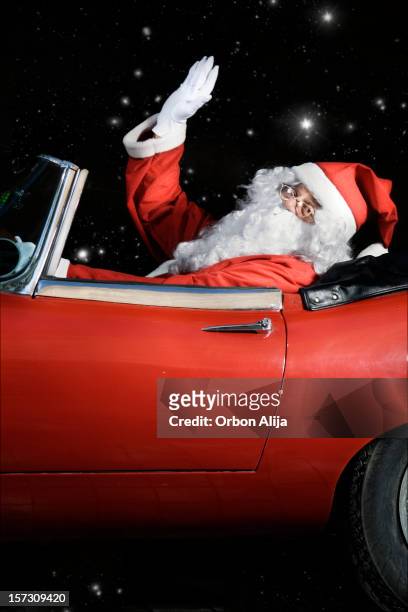 santa claus working - christmas driving stockfoto's en -beelden