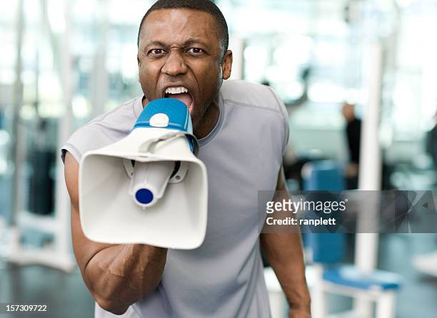 personal trainer with a megaphone - angry coach stock pictures, royalty-free photos & images