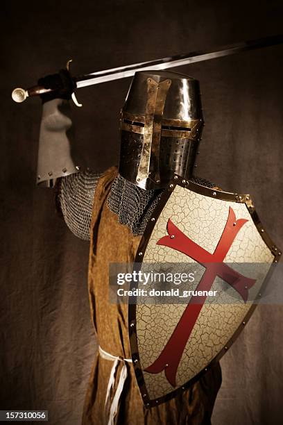 knight or crusader attacking with sword and shield - the crusades stockfoto's en -beelden