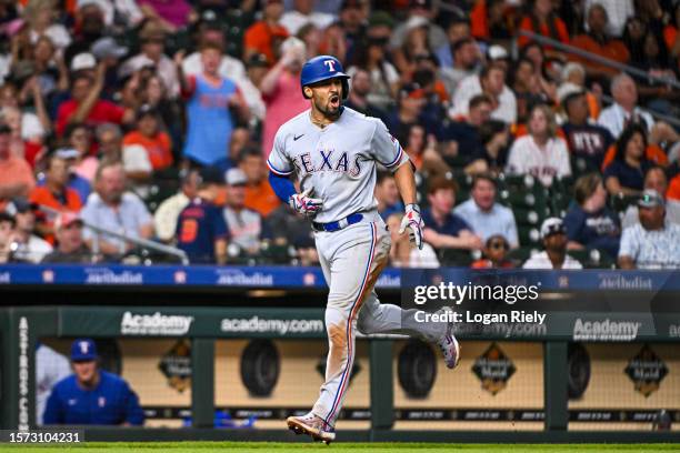 Marcus Semien of the Texas Rangers rounds the bases on a two-run home run in the fourth inning against the Houston Astros at Minute Maid Park on July...