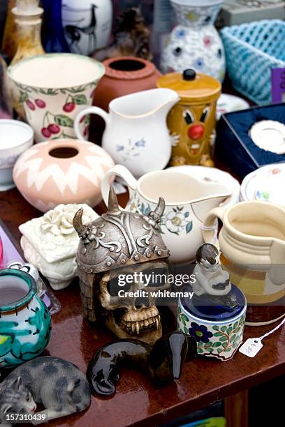 bric-a-brac stall at a market - skull helmet stock pictures, royalty-free photos & images