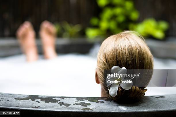 relaxing in hot tub - spa treatment stock pictures, royalty-free photos & images