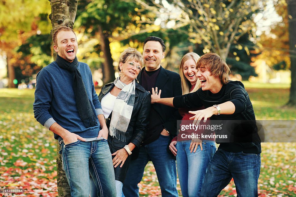 Happy Family of Five in an Autumn Park