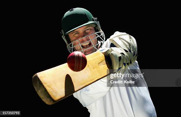 cricketer playing a shot - cricketspeler stockfoto's en -beelden