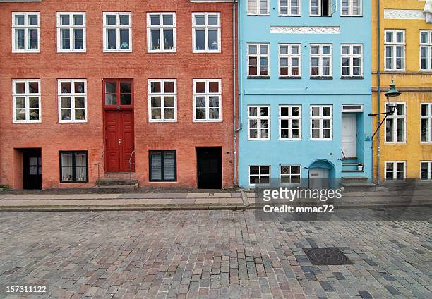 colorful traditional buildings - blue house red door stock pictures, royalty-free photos & images