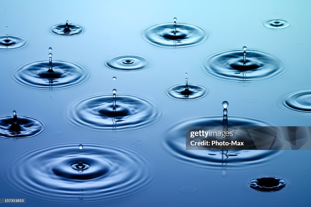 Many Drops Many Ripples Drops Of Rain On Water Surface Creating Ripples High-Res Stock Photo ...