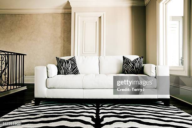 couch - animal print stock pictures, royalty-free photos & images