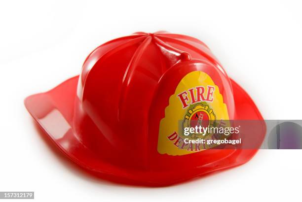 spielzeug feuerwehr hut - firefighter's helmet stock-fotos und bilder