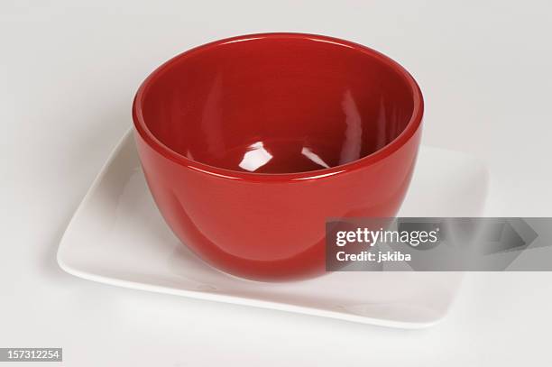 red rice bowl on white plate - white square plate empty stock pictures, royalty-free photos & images