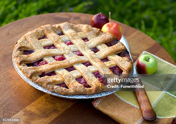 a home made cherry pie on a wooden table - cherry pie stockfoto's en -beelden