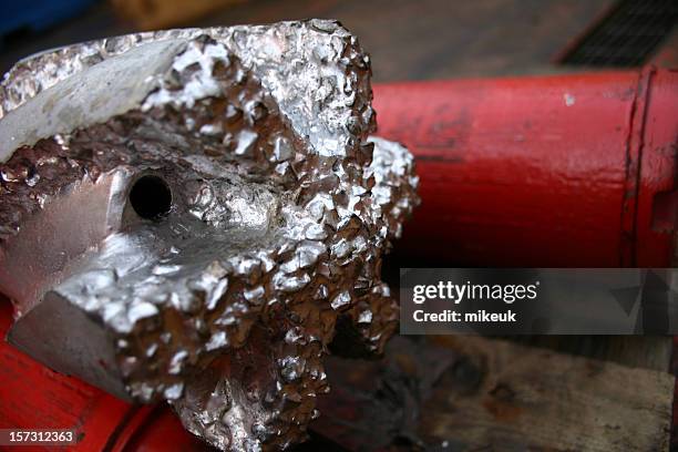 oil rig platform drill bit close up teeth detail - drill bit stockfoto's en -beelden